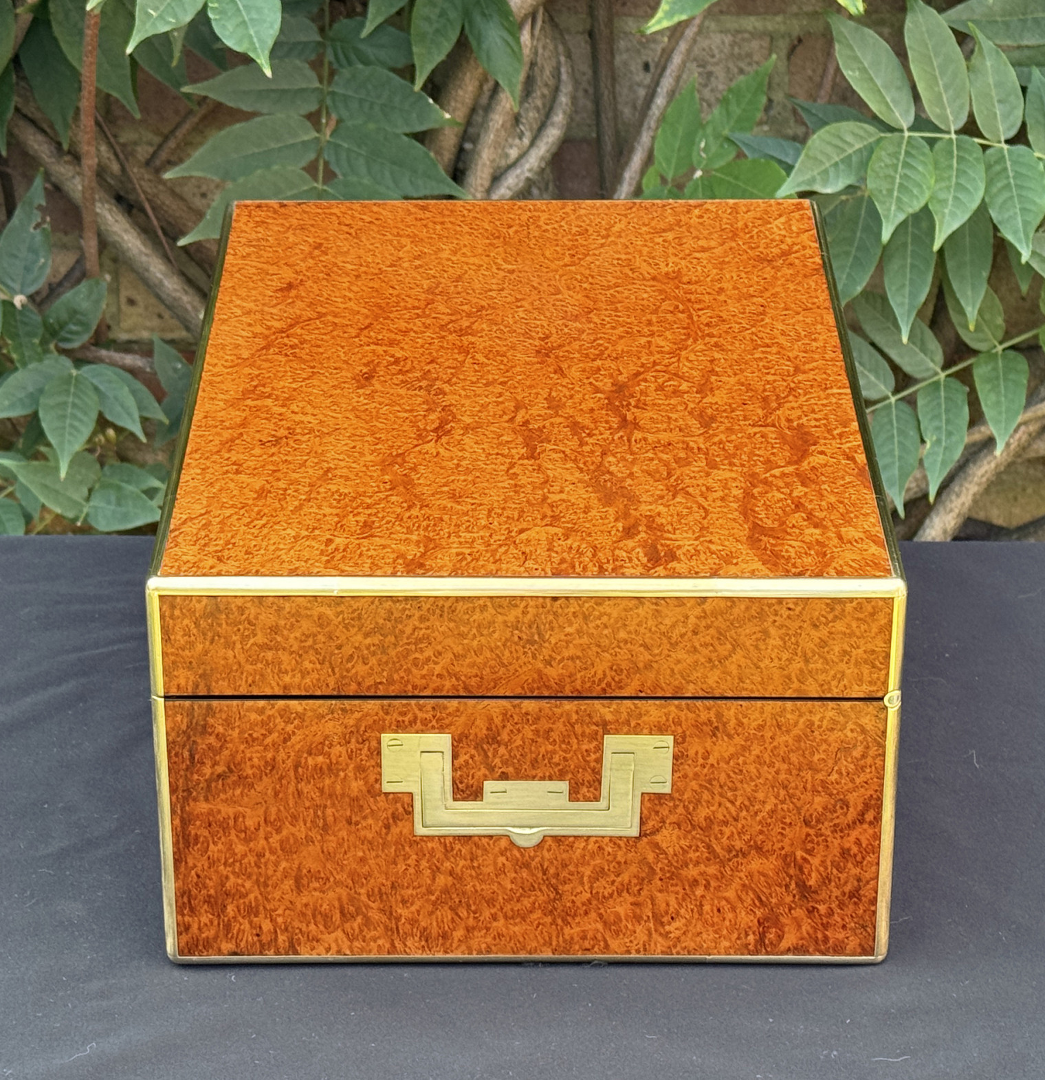 Right side view of an antique jewellery box in amboyna, by Edwards.