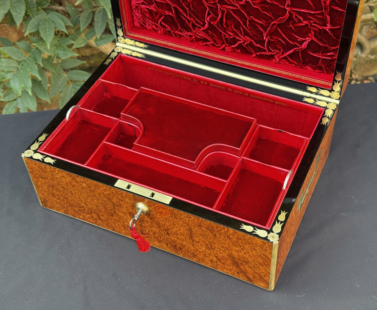 Closer overhead interior view of an antique jewellery box in amboyna, by Edwards.
