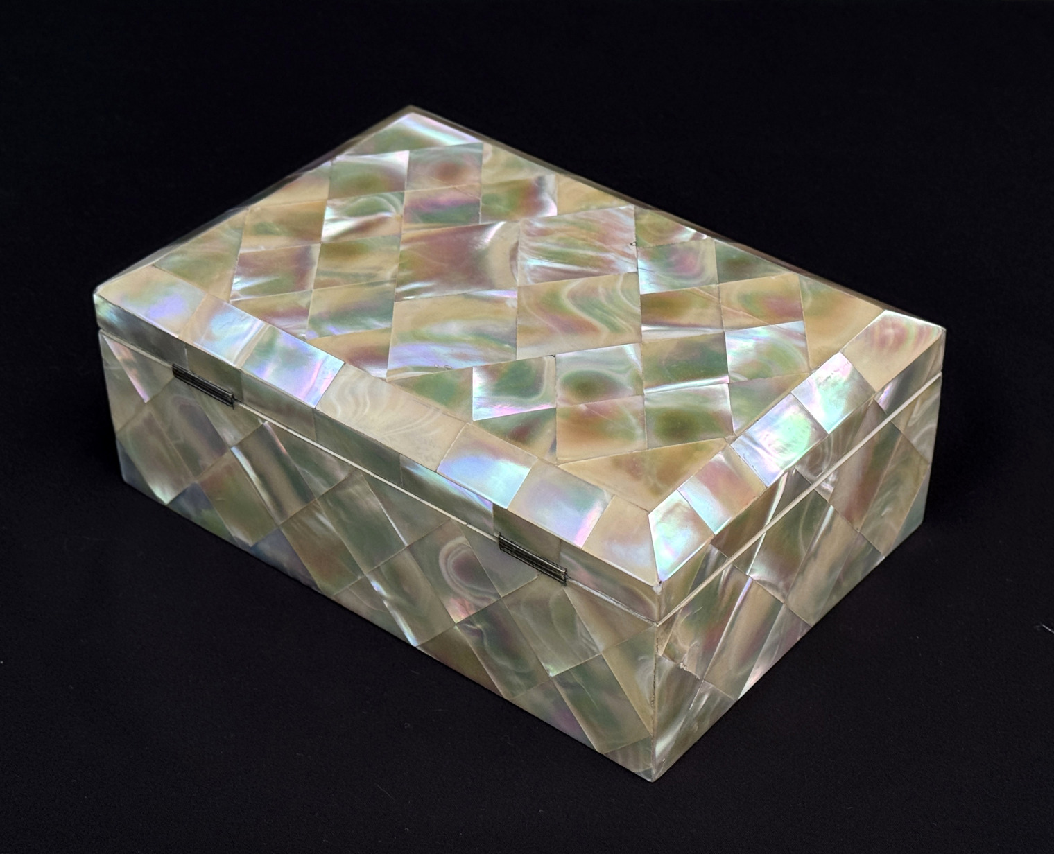 Rear left view of an antique mother of pearl inlaid jewellery box.