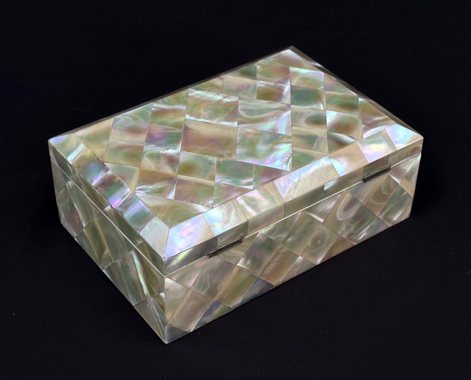 Rear right view of an antique mother of pearl inlaid jewellery box.