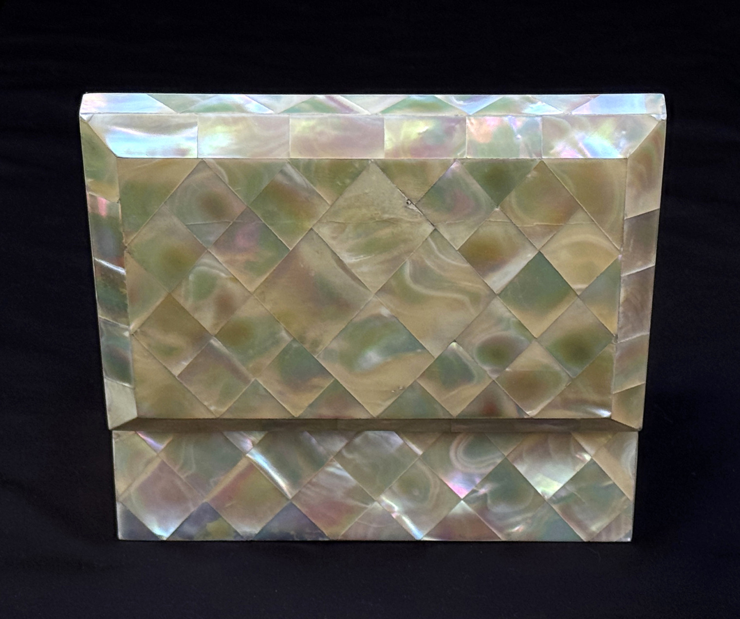 Rear opened view of an antique mother of pearl inlaid jewellery box.
