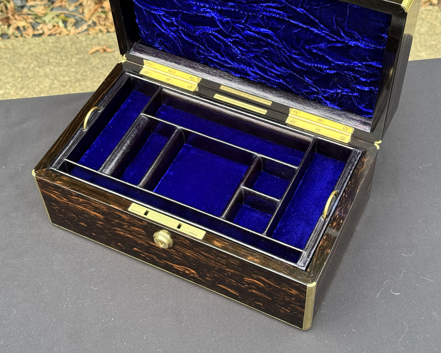 Closer overhead internal view of an antique gentleman's travelling jewellery box in coromandel, by Houghton & Gunn.