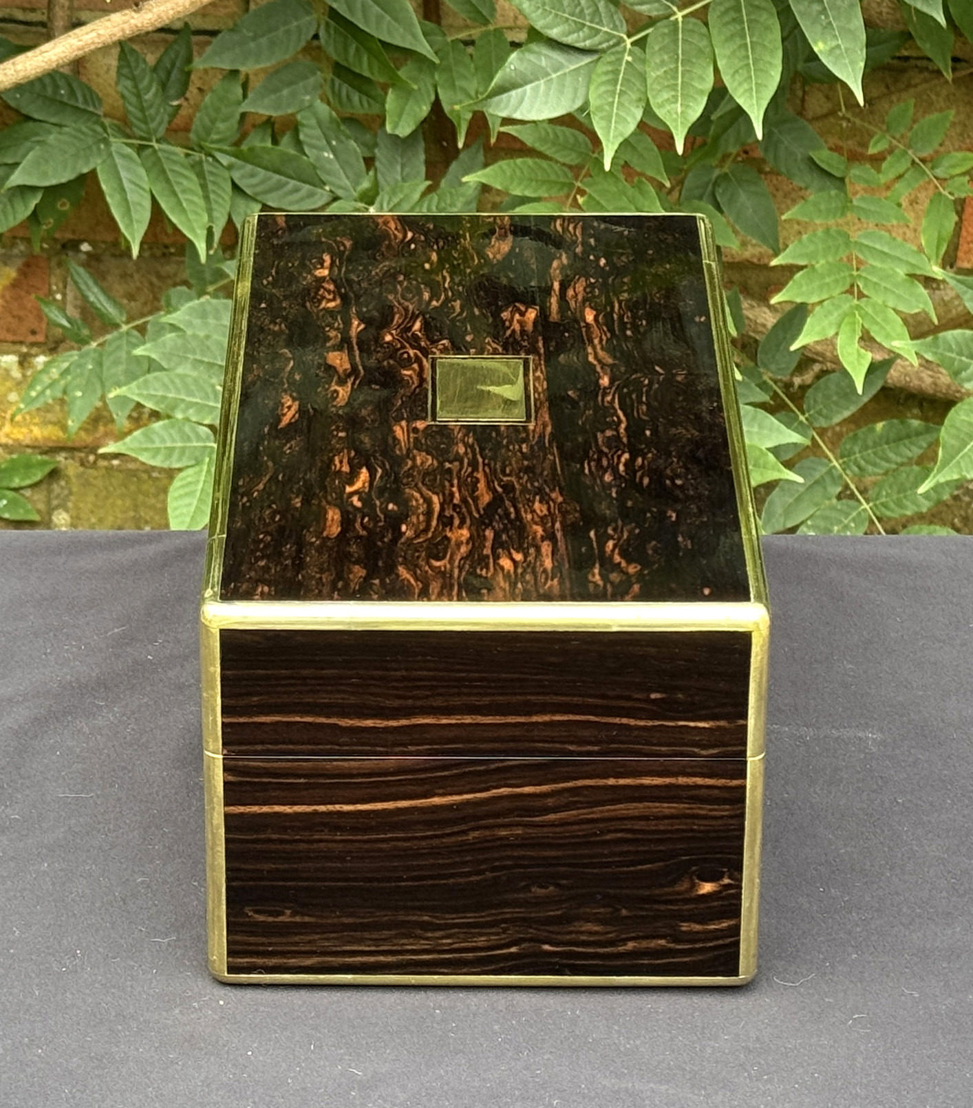 Right side view of an antique gentleman's travelling jewellery box in coromandel, by Houghton & Gunn.