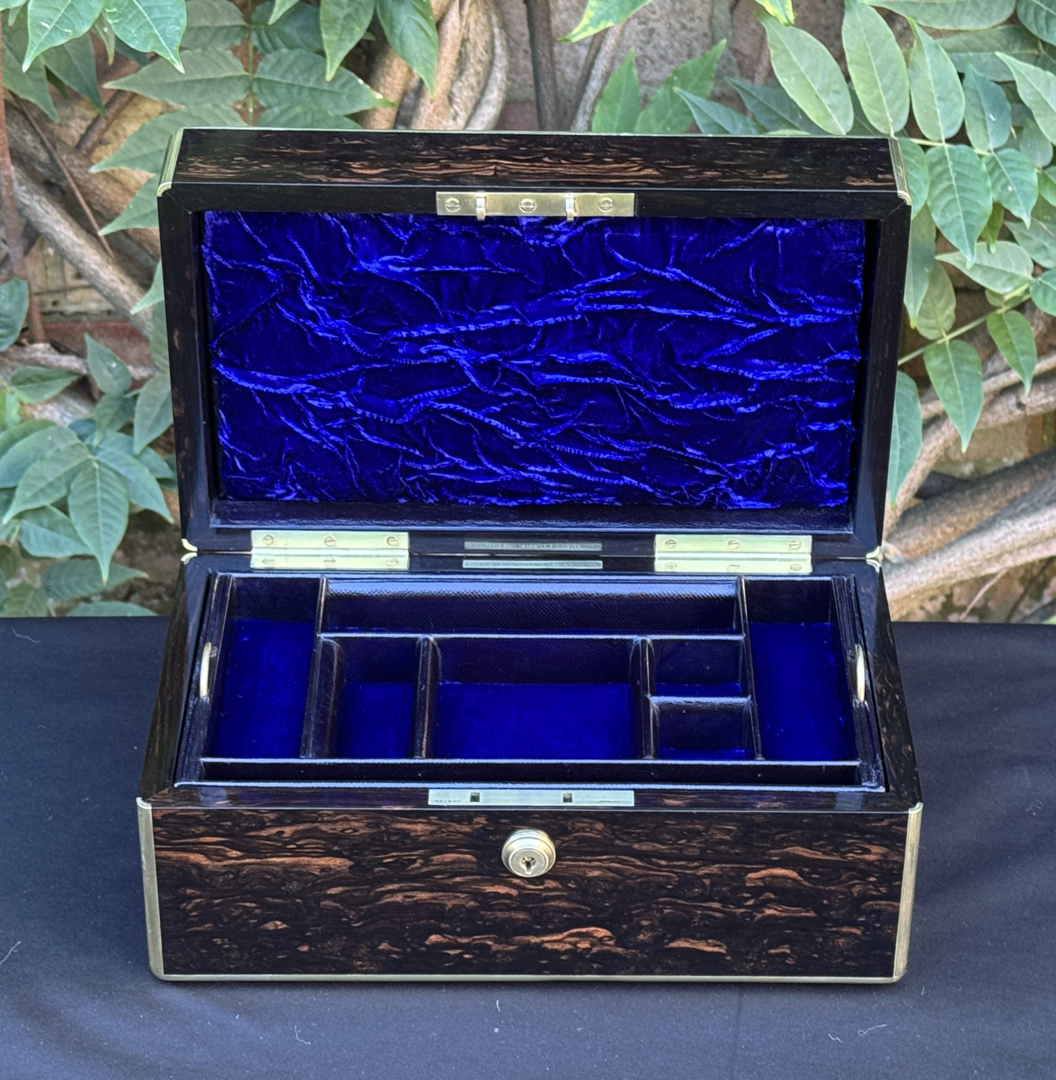 Front internal view of an antique gentleman's travelling jewellery box in coromandel, by Houghton & Gunn.