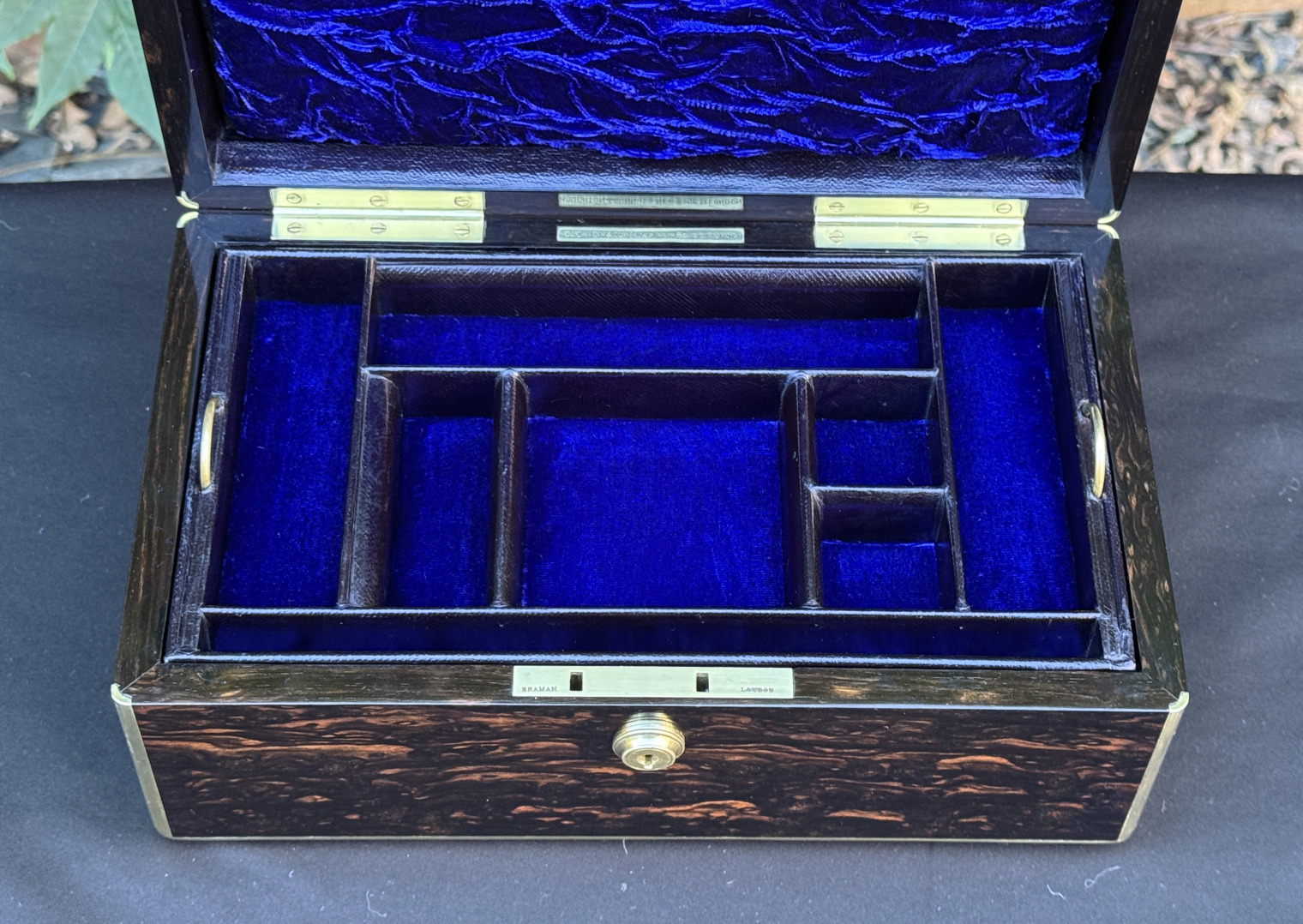 Closer internal view of an antique gentleman's travelling jewellery box in coromandel, by Houghton & Gunn.