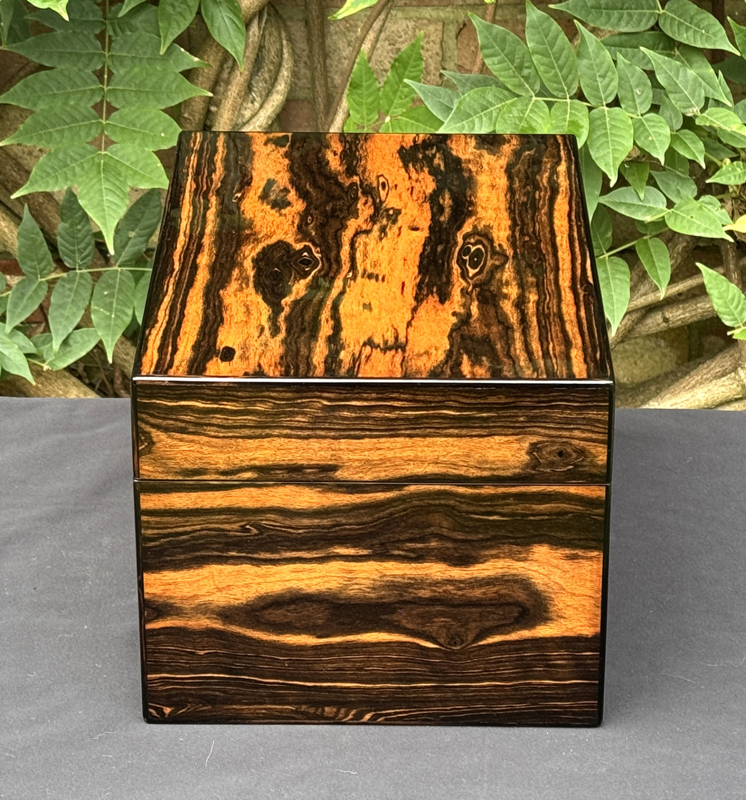 Right side view of an antique jewellery box in calamander, by George Betjemann & Sons.