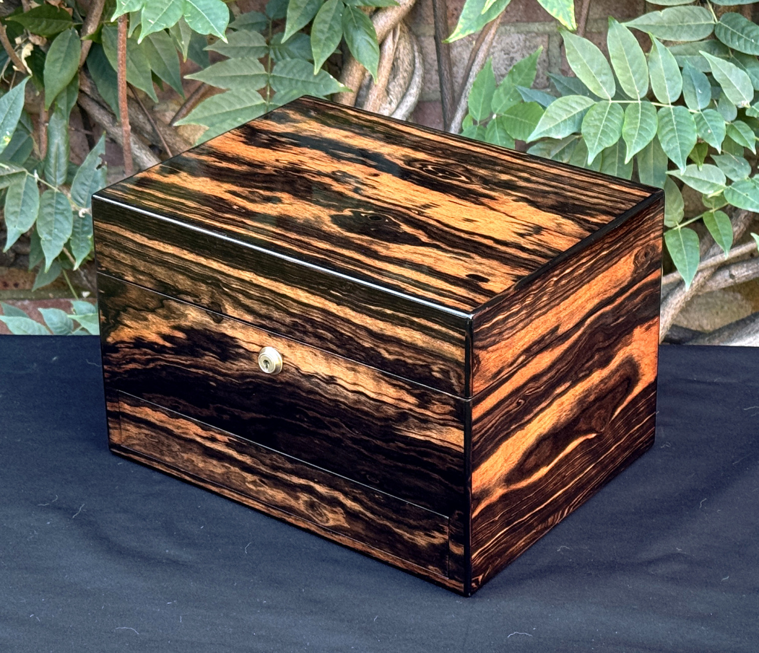 Front right view of an antique jewellery box in calamander, by George Betjemann & Sons.