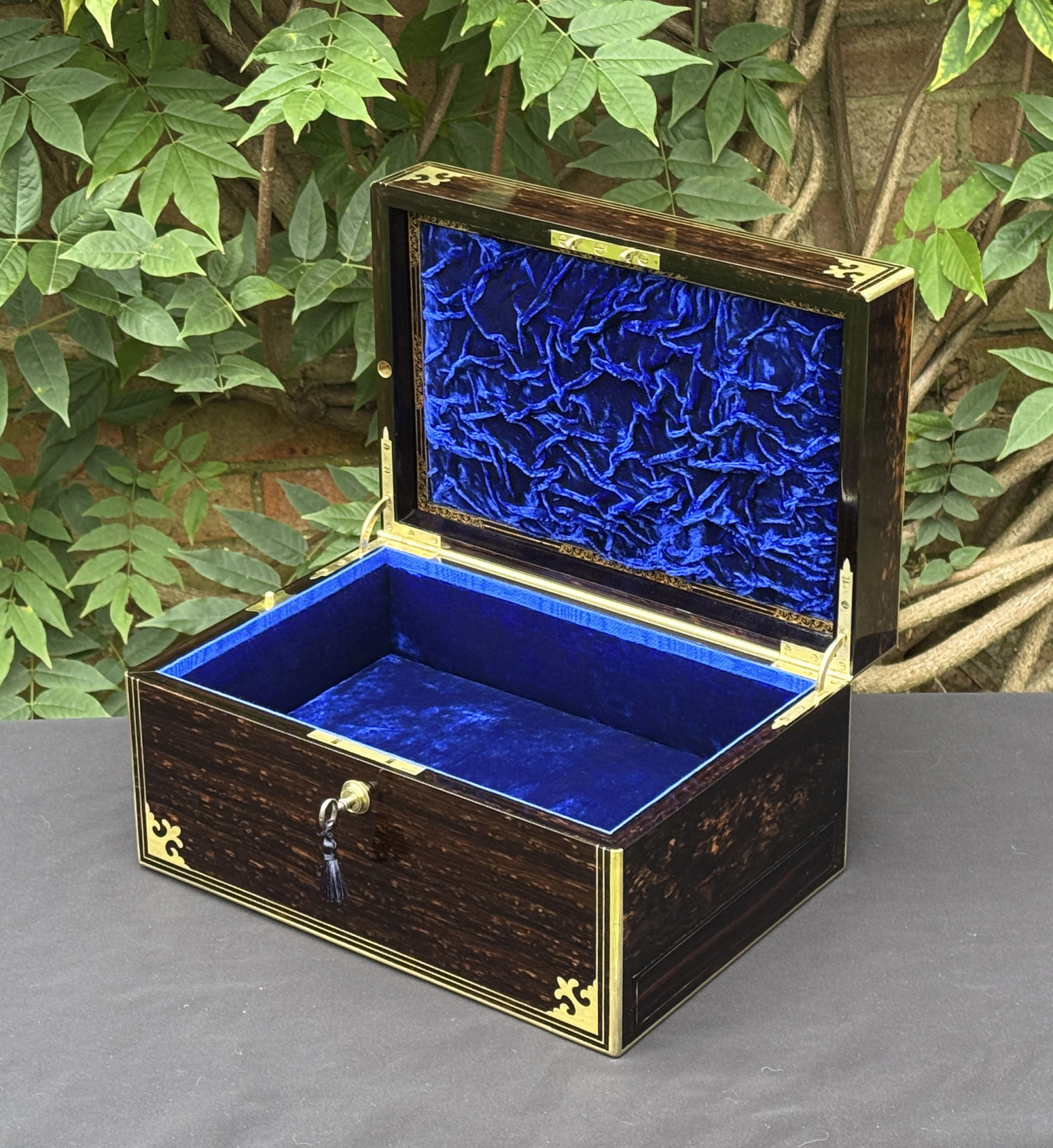 Front right interior view of an antique jewellery box in coromandel, by Thomas Dalton.