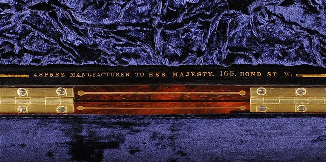 ‘Asprey. Manufacturer to Her Majesty. 166 Bond St. W.’ manufacturer’s mark gold tooled into leather.