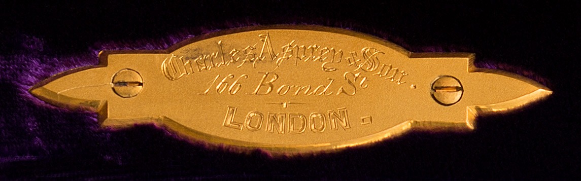 Charles Asprey & Son gilt-brass manufacturer’s plate from an antique jewellery box in coromandel.
