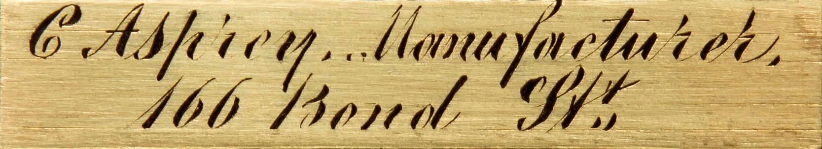 Charles Asprey engraved brass manufacturer’s plate.