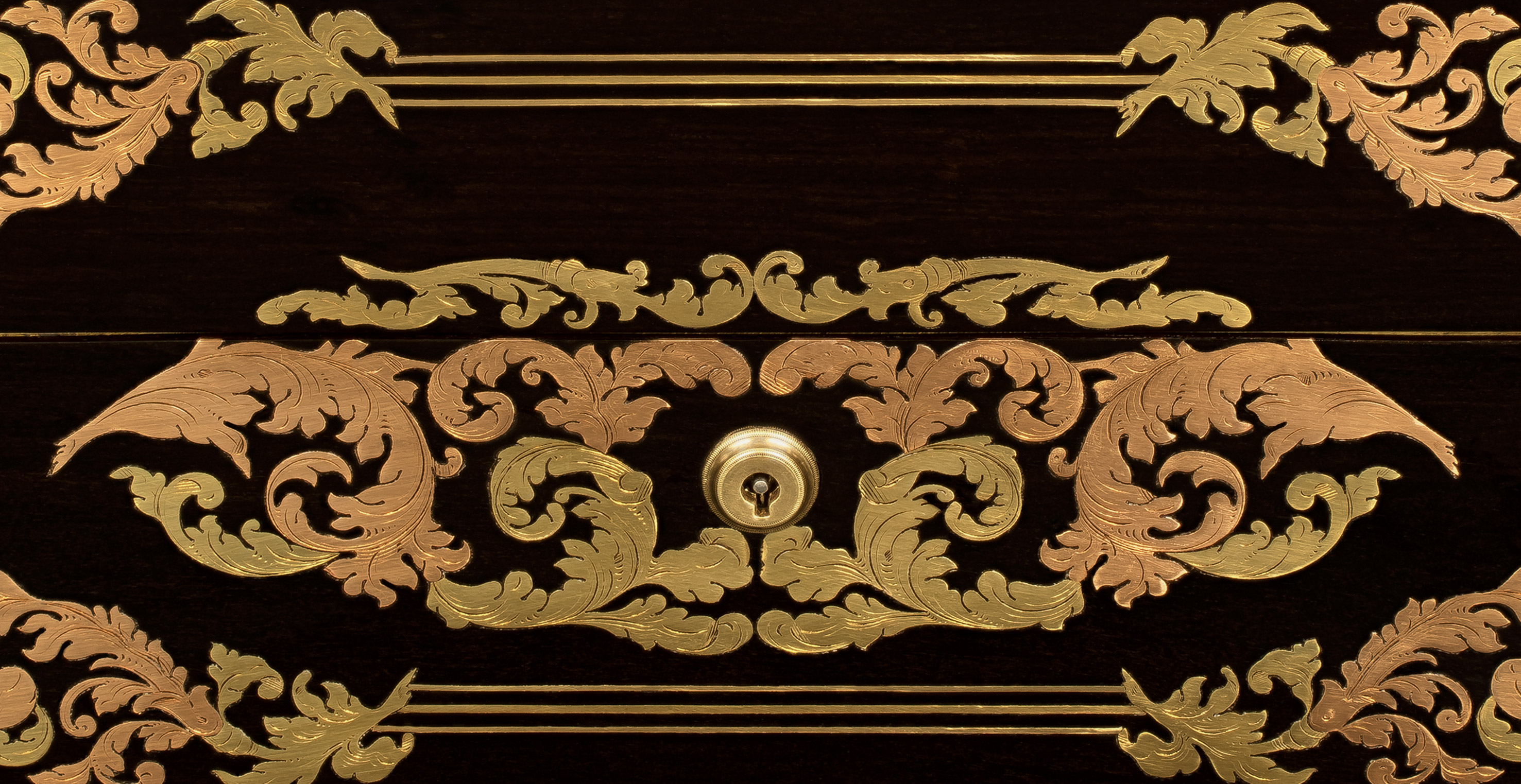 Yellow and rose brass foliate and scrollwork inlay from a French antique jewellery box in ebony. Yellow brass (standard brass) contains about 67-70% copper whilst rose brass contains about 85% copper hence the pinkish appearance.