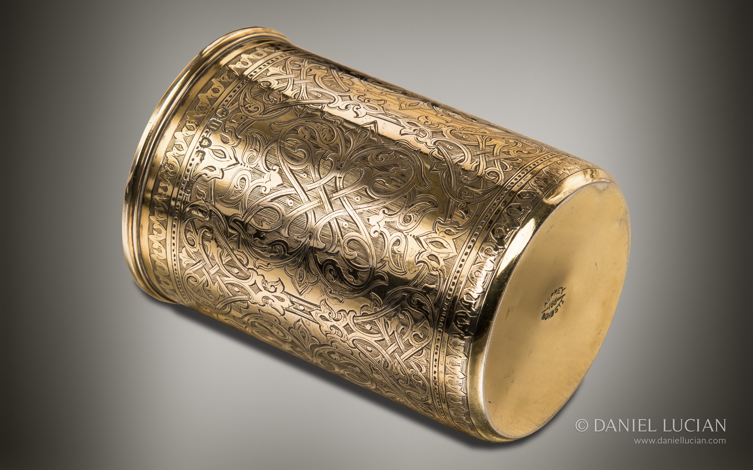 Engraved silver-gilt beaker from an antique dressing case by Asprey & Sons.