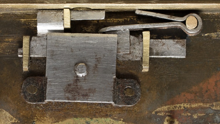 An 1820’s French lock in its ‘double locked’ position. Note the elongated bolt arm (top centre) to allow for the mechanism’s double throw action.