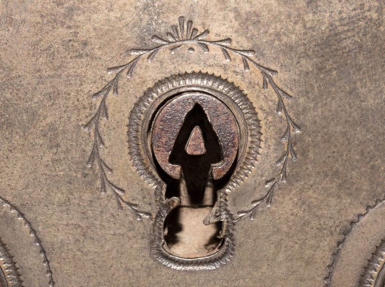 1789 French lock with triangular shaped drill pin and surrounding curtain. Note the small prongs to the edges of the key hole; this requires a ‘Z’ shaped key bit to pass through it.