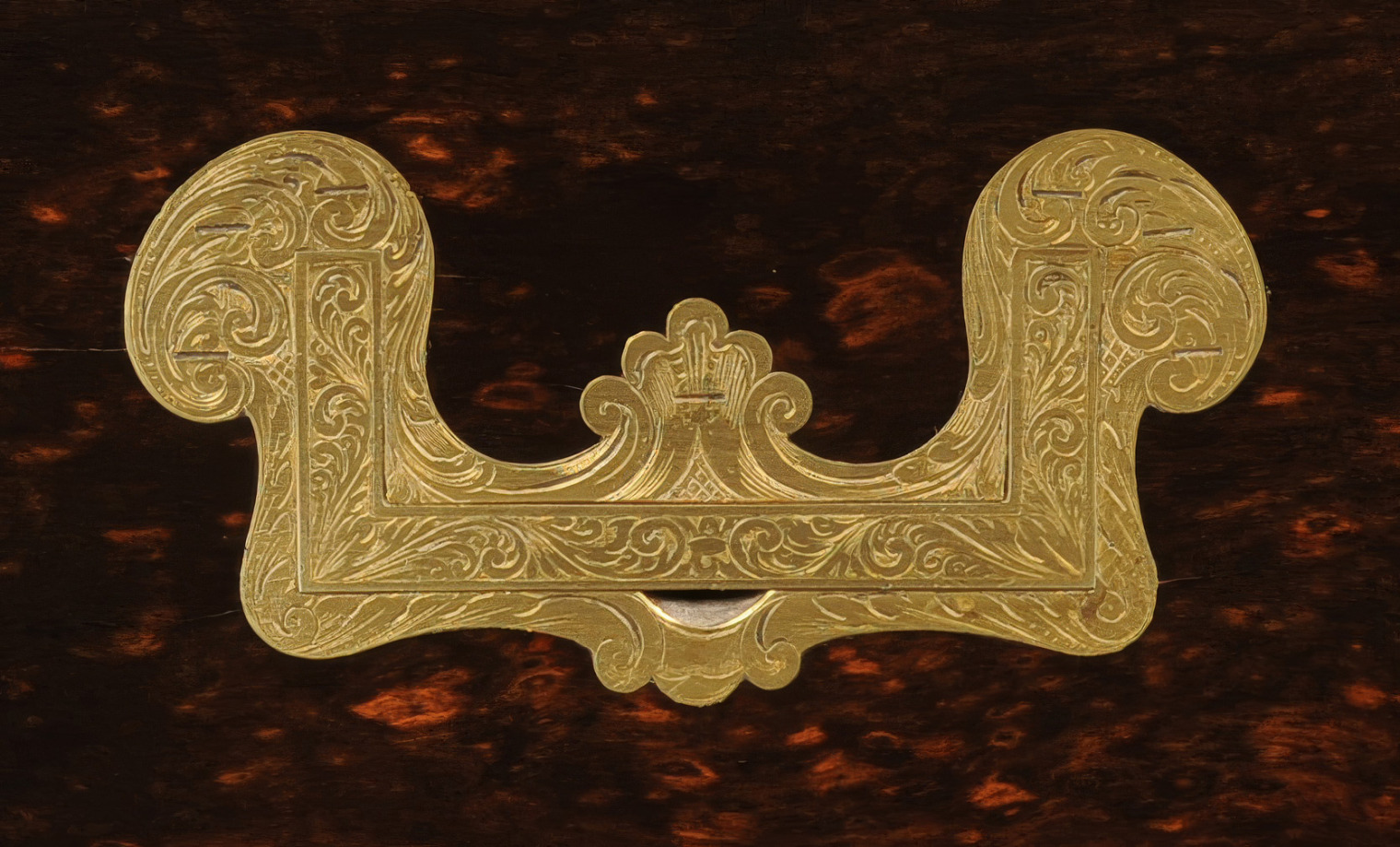 Antique brass engraved handle.