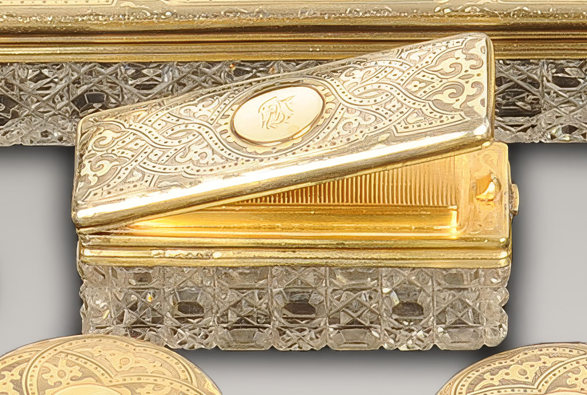 Cut-glass matchbox and match striker with an engraved silver-gilt lid by Walter Thornhill.