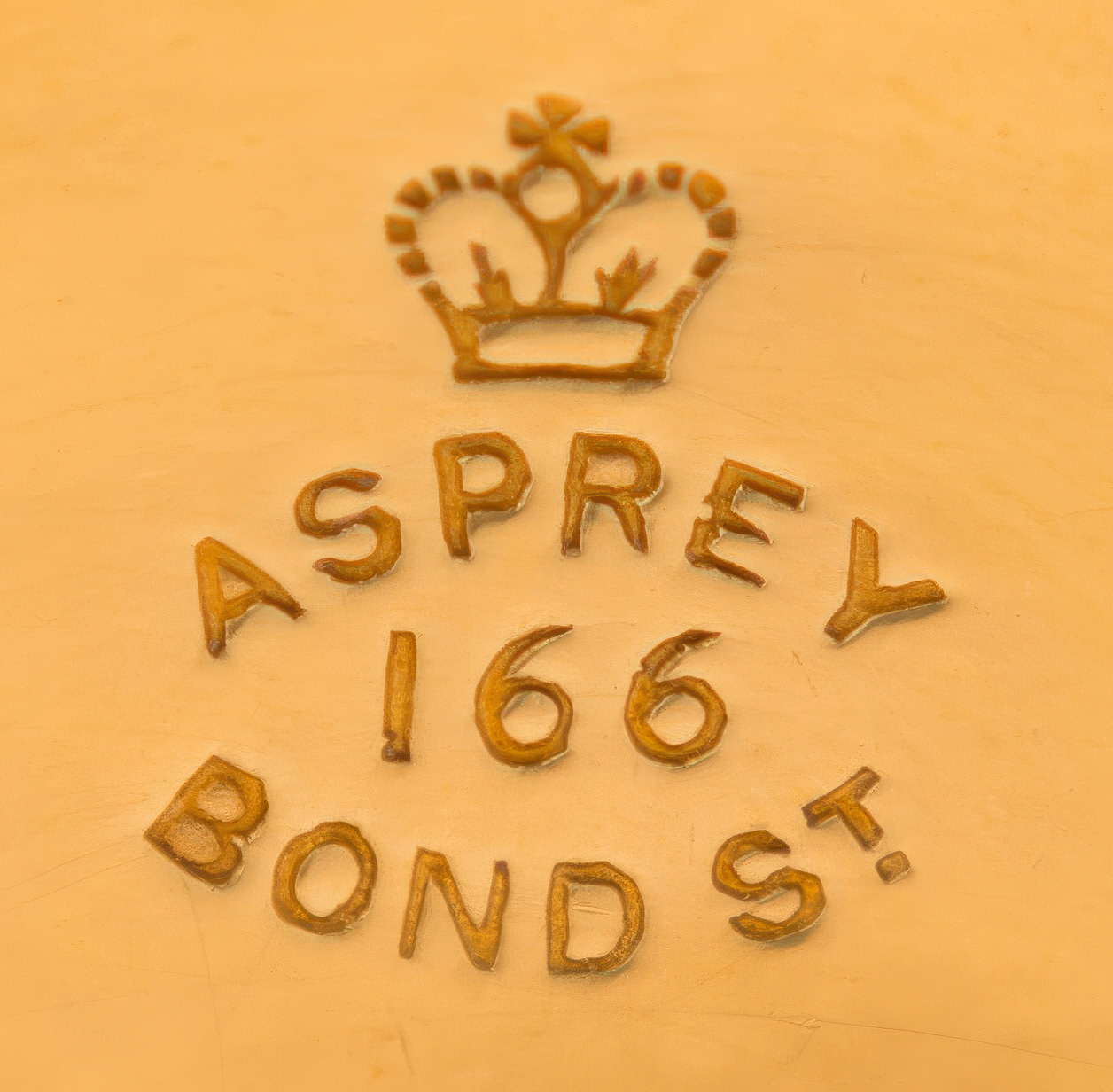 &lsquo;Asprey &ndash; 166 Bond St&rsquo; stamped into a silver-gilt dressing case fitting.