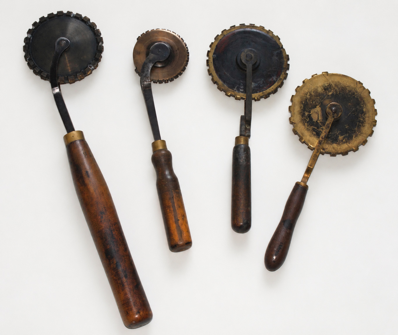 Bookbinder’s finishing rolls, used to create continuous decorative borders and repeating patterns in leather, either in gold leaf or as blind tooling.