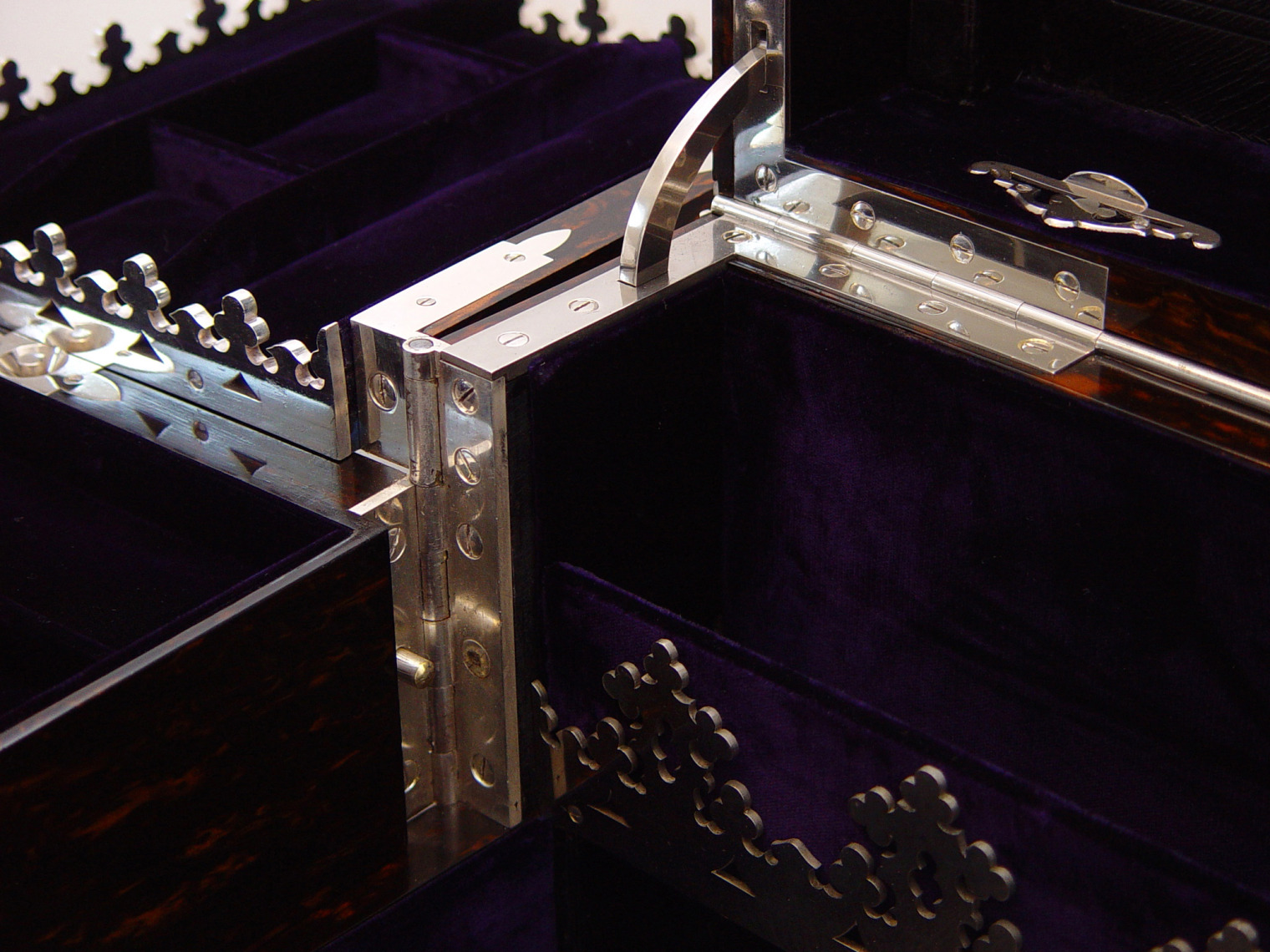 Nickel plated hinge and galleries from an antique jewellery box with Betjemann Patent mechanism by Jenner & Knewstub.